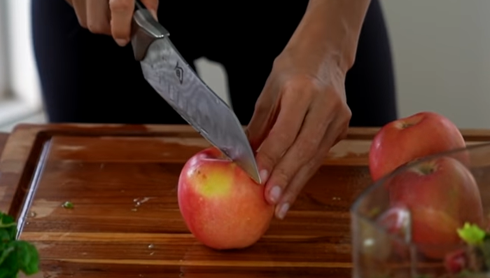 Cutting apple through knife