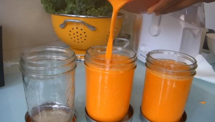 pouring juice in clean container