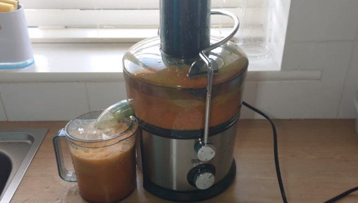 making juice in a juicer.