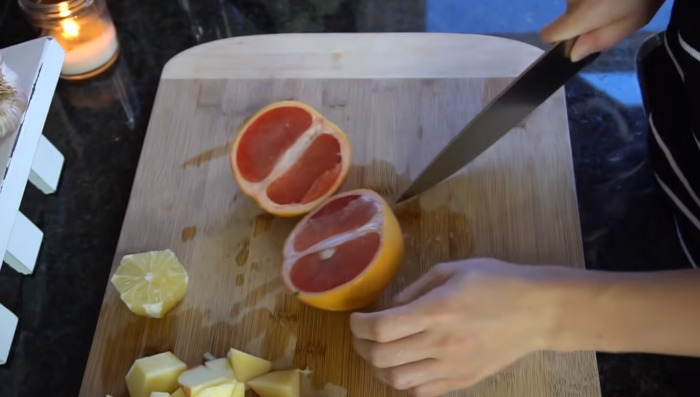 cutting grapefruit with knife