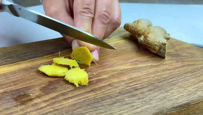 cutting ginger with knife