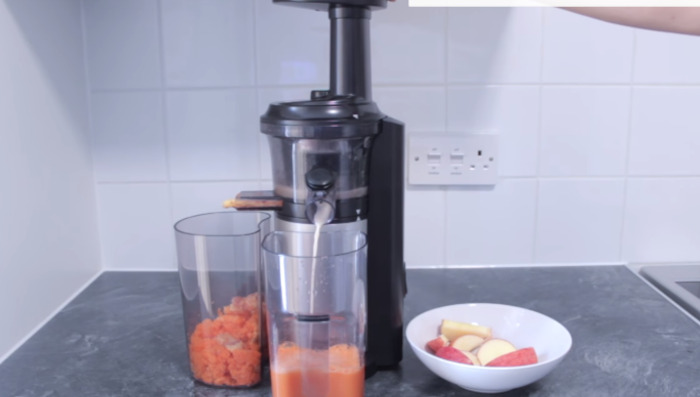 making juice in juicer